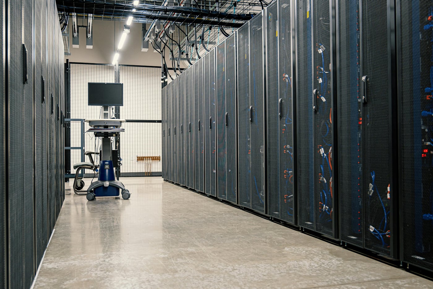 Rows of server racks in a modern data center